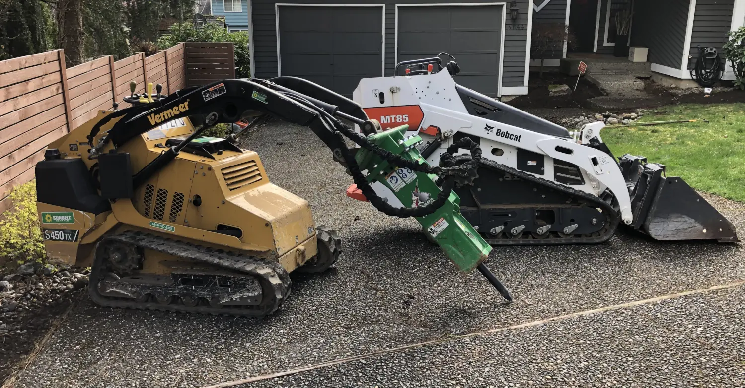 Before replacement: older driveway with construction equipment. Before replacement: older driveway with construction equipment.